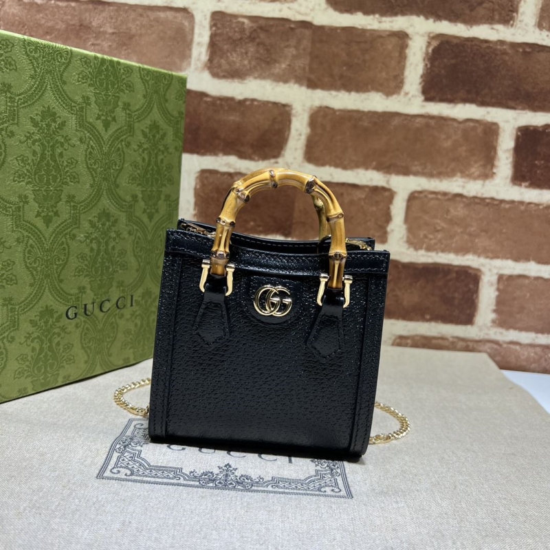 G*u*i top handle bags